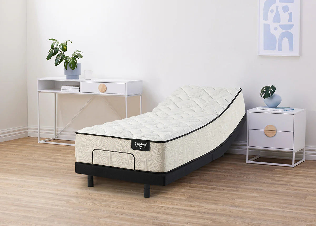 Sleepyhead Flexirest mattress on an adjustable base in a bedroom setting with nightstands and decor.