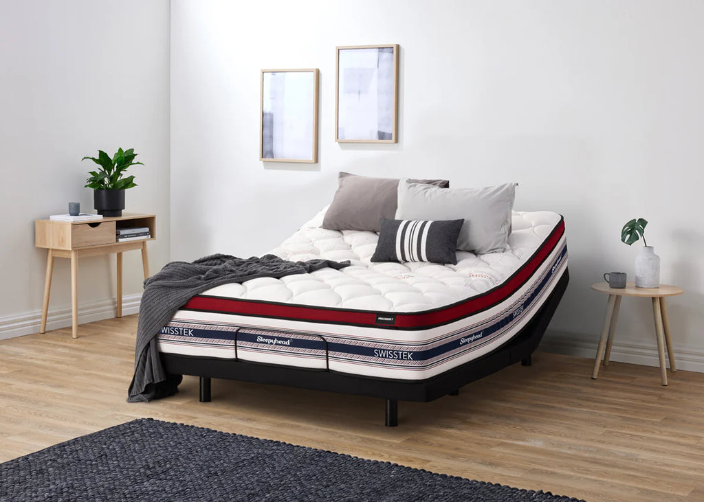 Sleepyhead Swisstek mattress in a bedroom setting with decor elements.