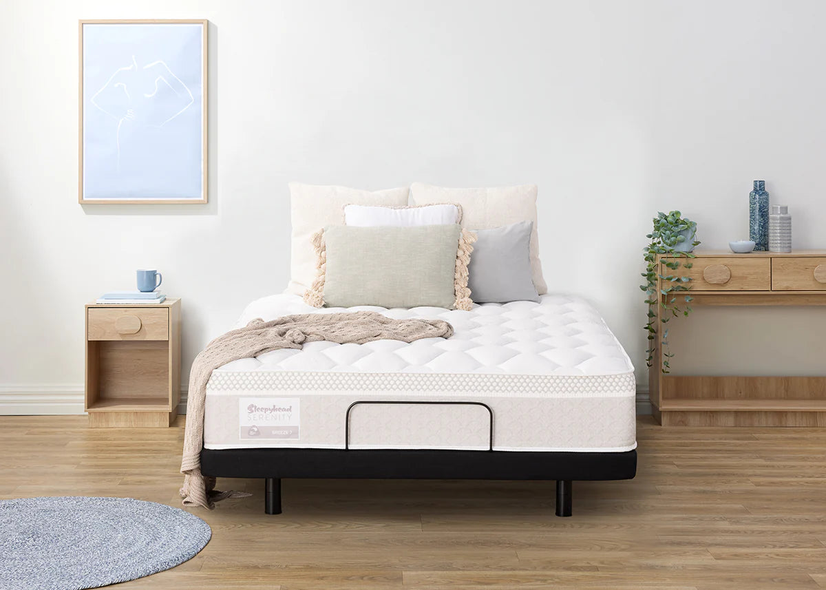Sleepyhead Serenity mattress on a bed in a bedroom setting with wooden furniture and decor.