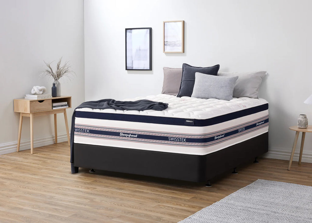 Sleepyhead Swisstek mattress in a bedroom setting with decor elements.