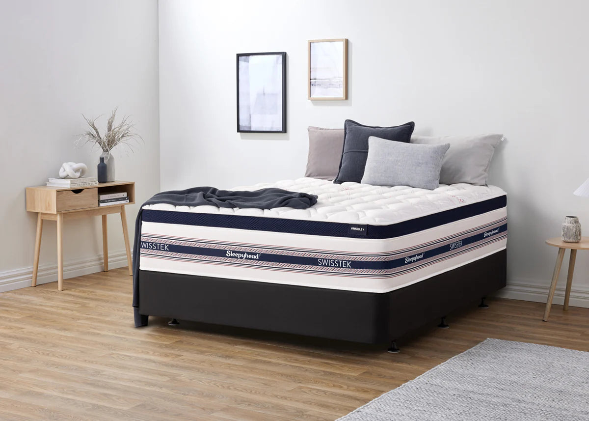Sleepyhead Swisstek mattress in a bedroom setting with decor elements.