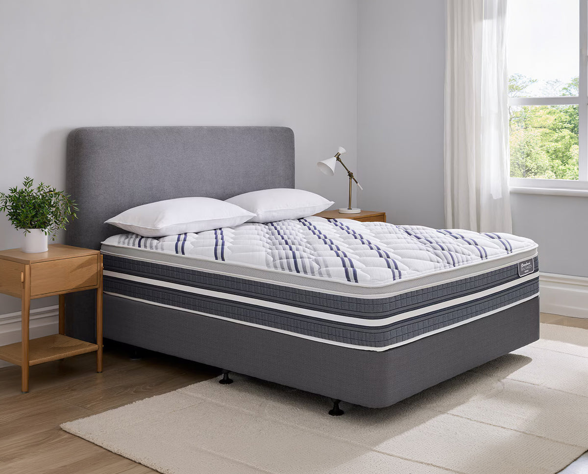 Grey Sleepyhead Balance+ bed with striped mattress in a bedroom setting