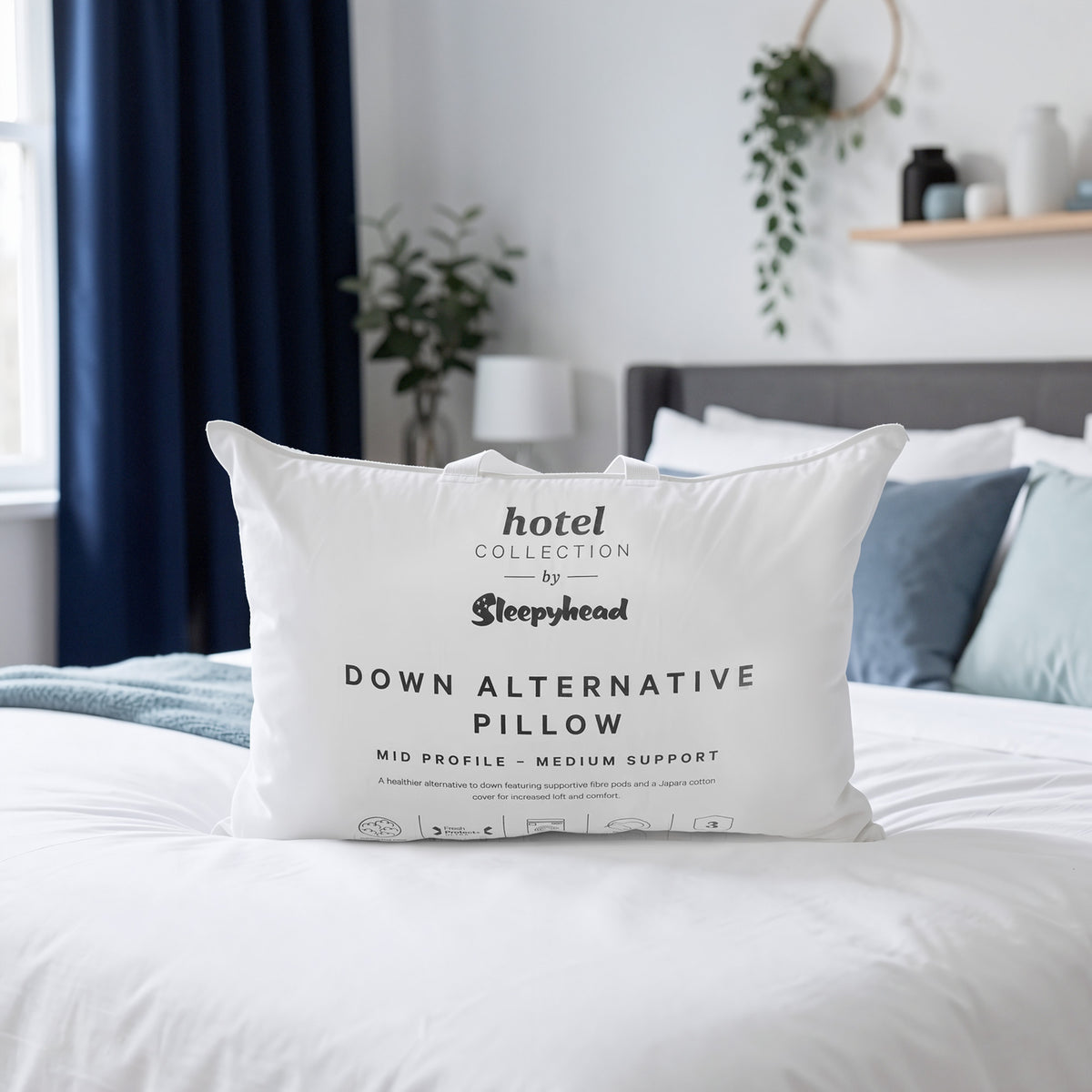Sleepyhead down alternative pillow on a bed in a bedroom setting