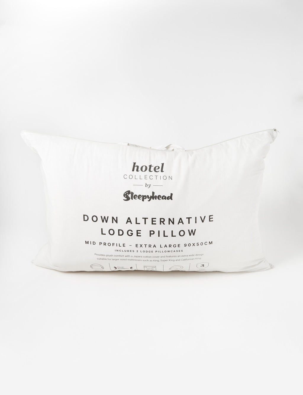 White pillow with 'hotel collection' and 'Sleepyhead' branding on a white background