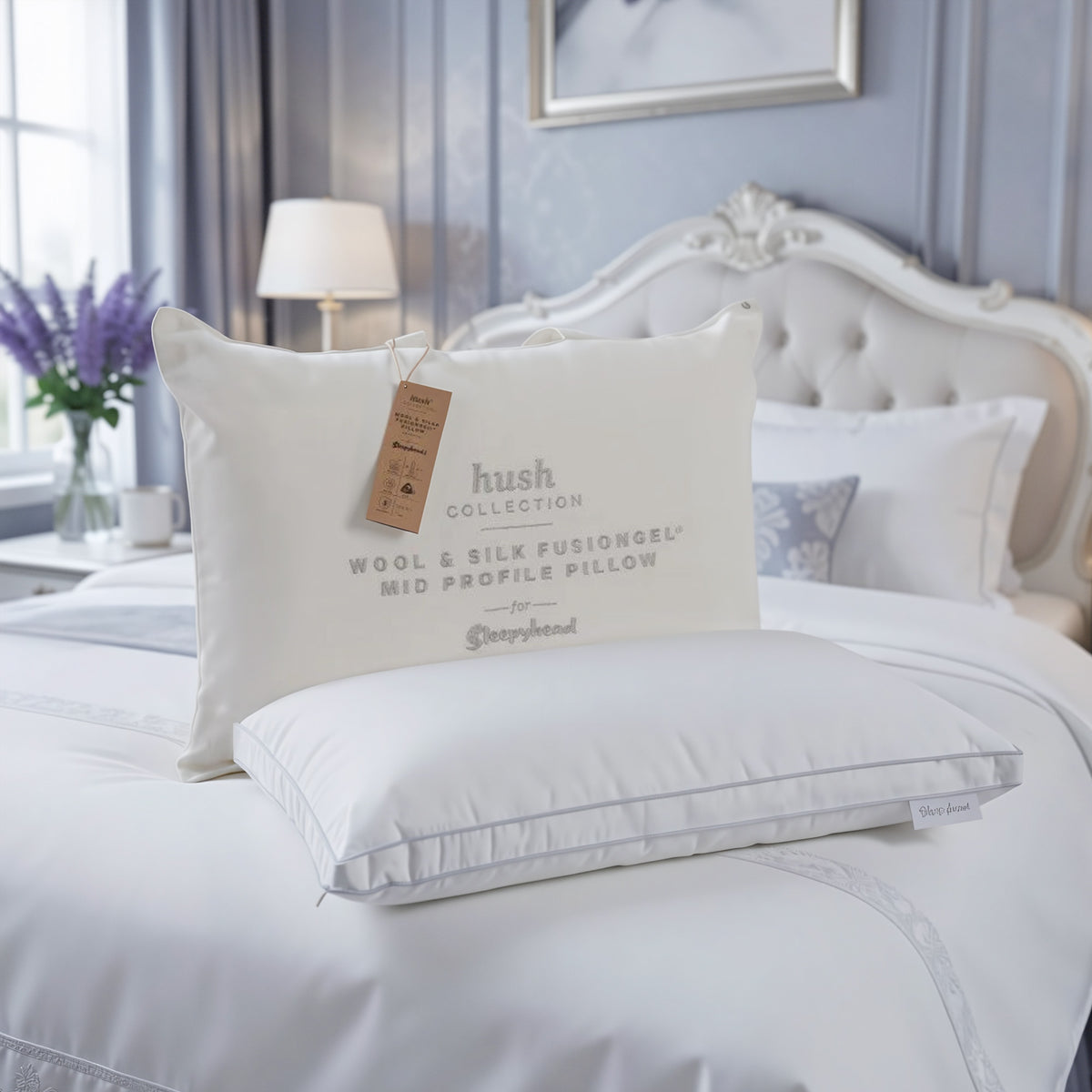 Sleepyhead Hush pillow on a bed with a visible tag in a bedroom setting