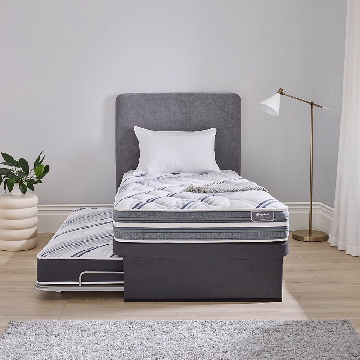 Sleepyhead Balance trundler bed base and popup mattress in a bedroom setting
