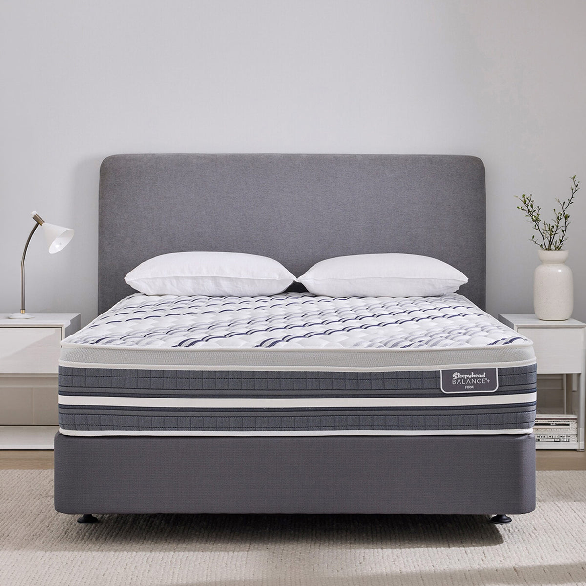Grey Sleepyhead Balance+ bed with white pillows and a visible mattress brand in a bedroom setting