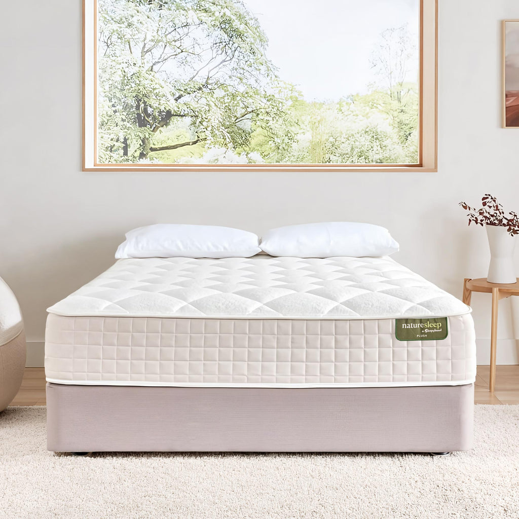 Sleepyhead Naturesleep mattress on a bed in a room with a large window