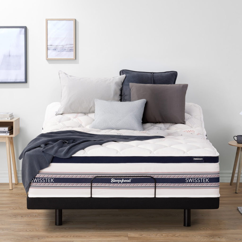 Sleepyhead Swisstek mattress on an adjustable base with pillows and a blanket in a bedroom setting