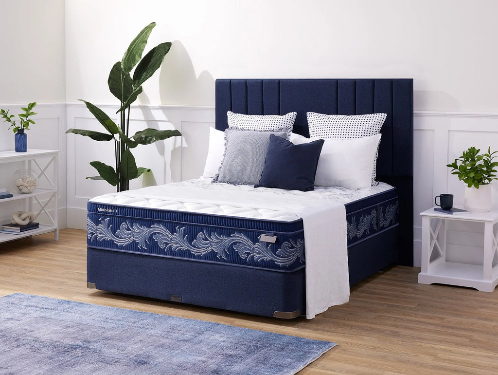 Sleepyhead Sanctuary bed with decorative pillows in a bedroom setting