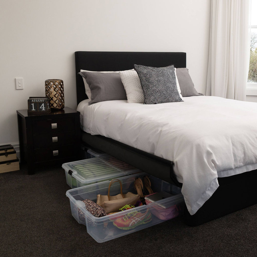 Bedroom with a Sleepyhead Spacebase bed base with clear storage bins underneath.