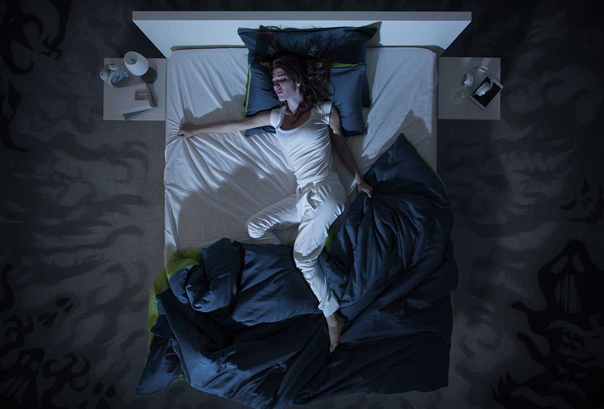 women sleeping on a big bed at night